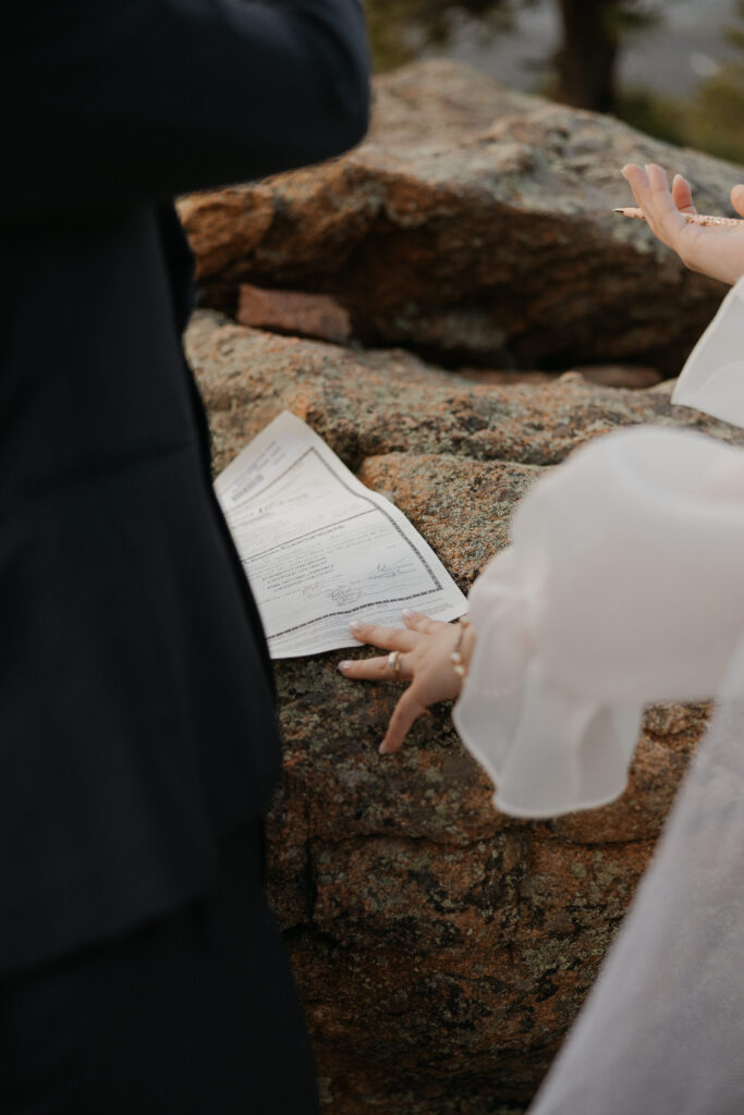 3m curve elopement ceremony signing their license 