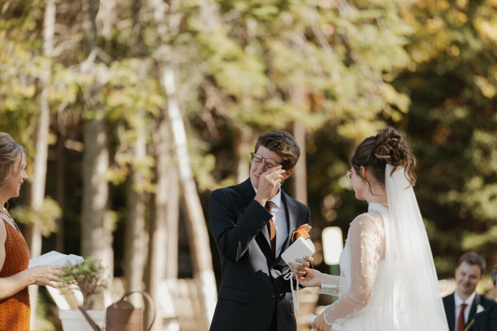 Groom getting emotional during vows at his micro wedding