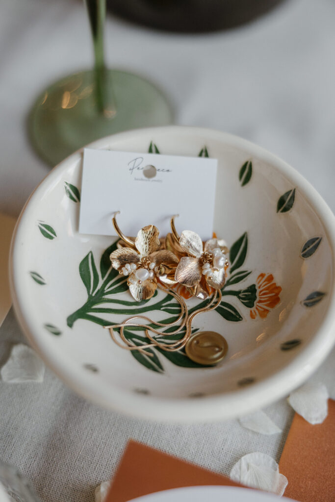 brides earrings in a dish 