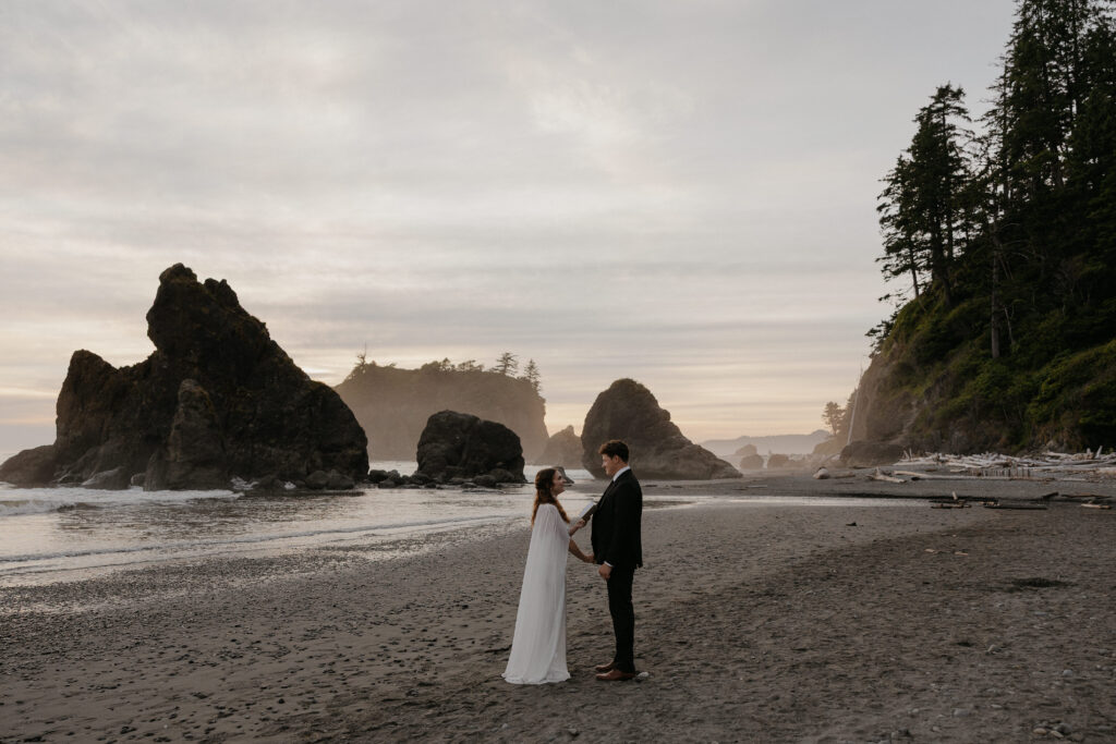 Couple sharing elopement vows on Ruby Beach