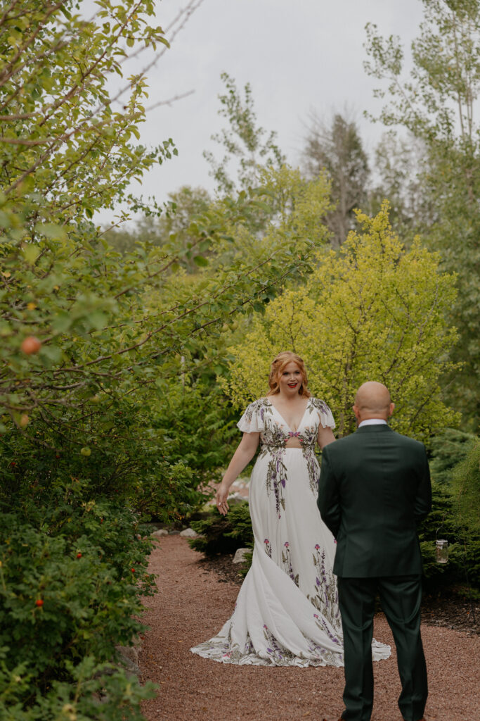 bride and groom doing a first look right before it rains at their wedding ceremony
